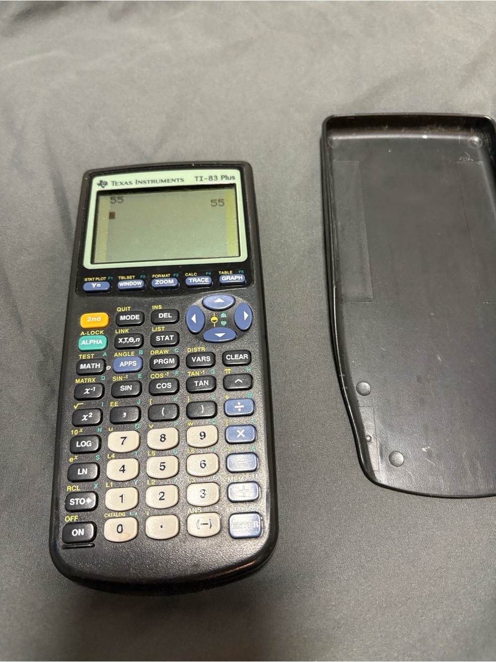 Texas Instruments TI-83 Plus Graphing Calculator in Black and Cream